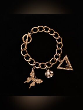 GUESS Gold-Tone Rhinestone Charm Bracelet | Pavé Crystal Clusters